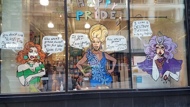 Pride Parade graphics in the window of a book store on the Magnificent Mile in Chicago.