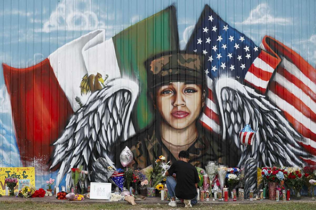 Mural of Vanessa Guillén with angel wings, with the flags of México and the United States behind her