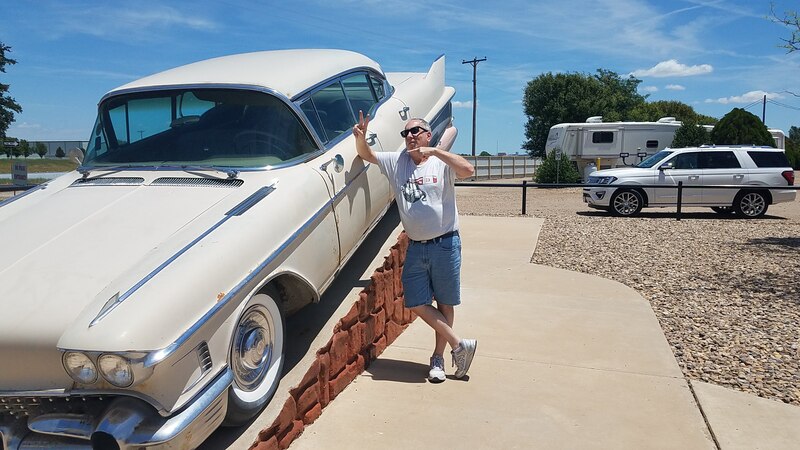 dbc with a white 1958 Sedan de Ville at the souvenir shop near the Cadillac Ranch.