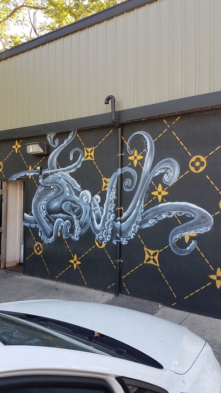 Stylized octopus mural on the outer wall of a sushi restaurant near the University of Utah campus in Salt Lake City