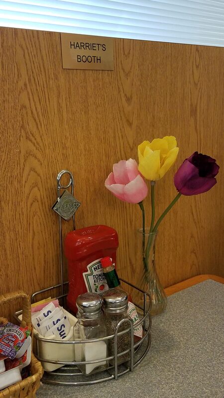 Silk flowers adorn "Harriet's Booth at Pannekoeken Huis in St. Louis Park MN (Twin Cities).