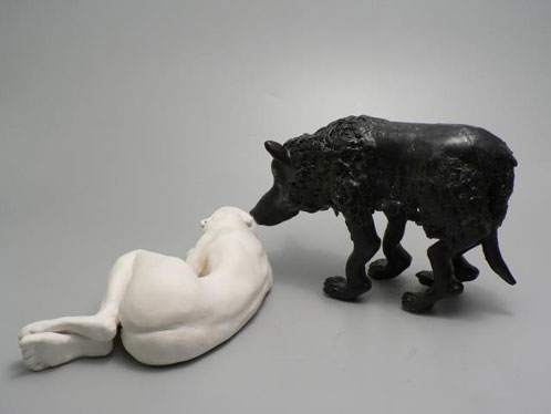 The Black Dog of Depression sniffs at a naked human figure in a fetal position.
