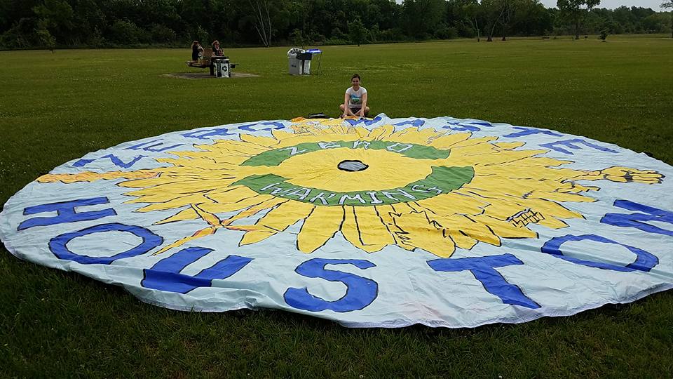 Melanie Scruggs with the Texas Campaign for the Environment parachute banner at the People's Climate March